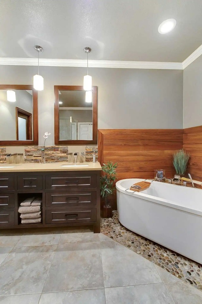 Remodeled bathroom with vanity and tub