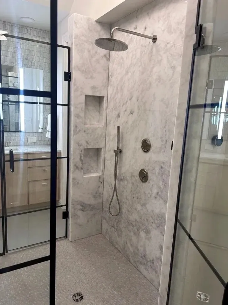 Bathroom with tall wood storage, vanity, and Crittall-style shower glass