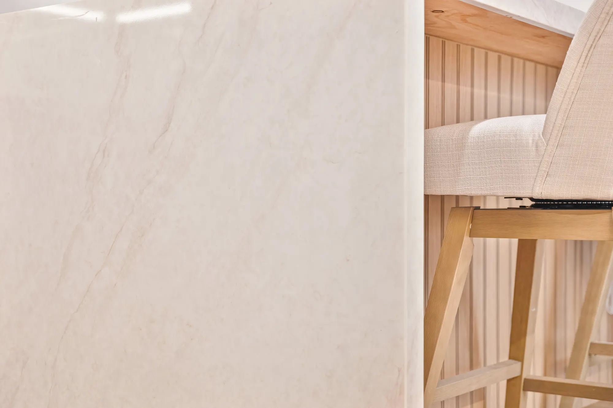 Bathroom vanity with natural stone vessel sink and gold fixtures