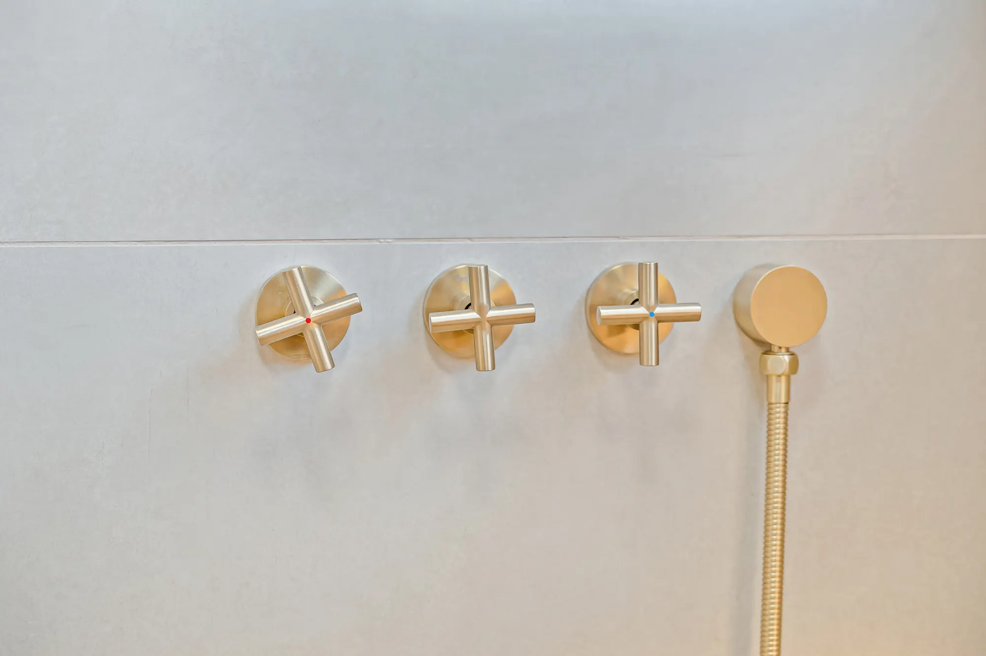 Bathroom vanity with natural stone vessel sink and gold fixtures