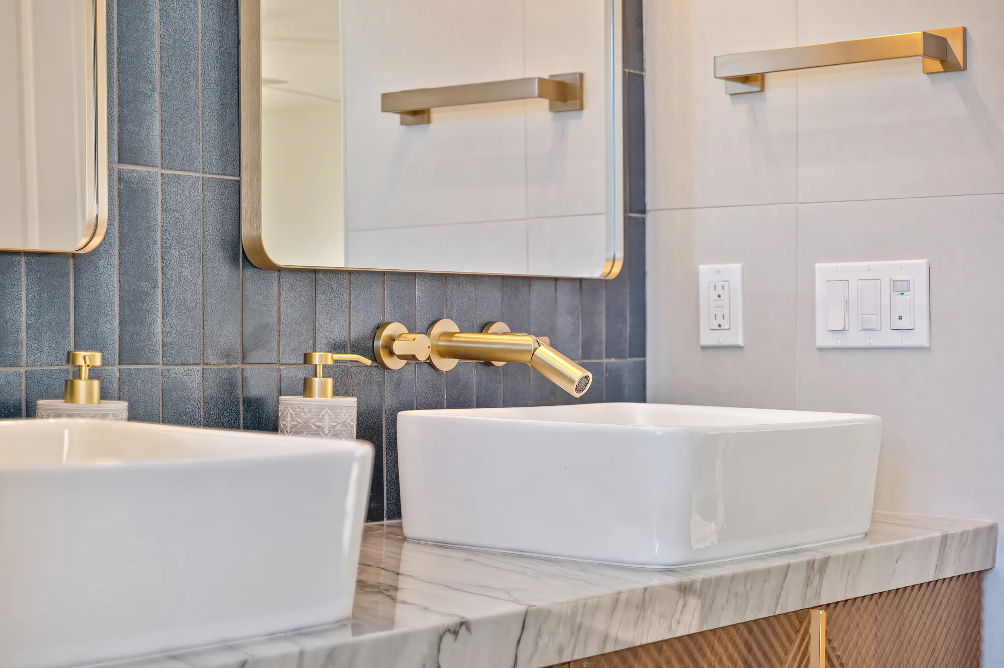 Double vanity bathroom remodel with gold hardware
