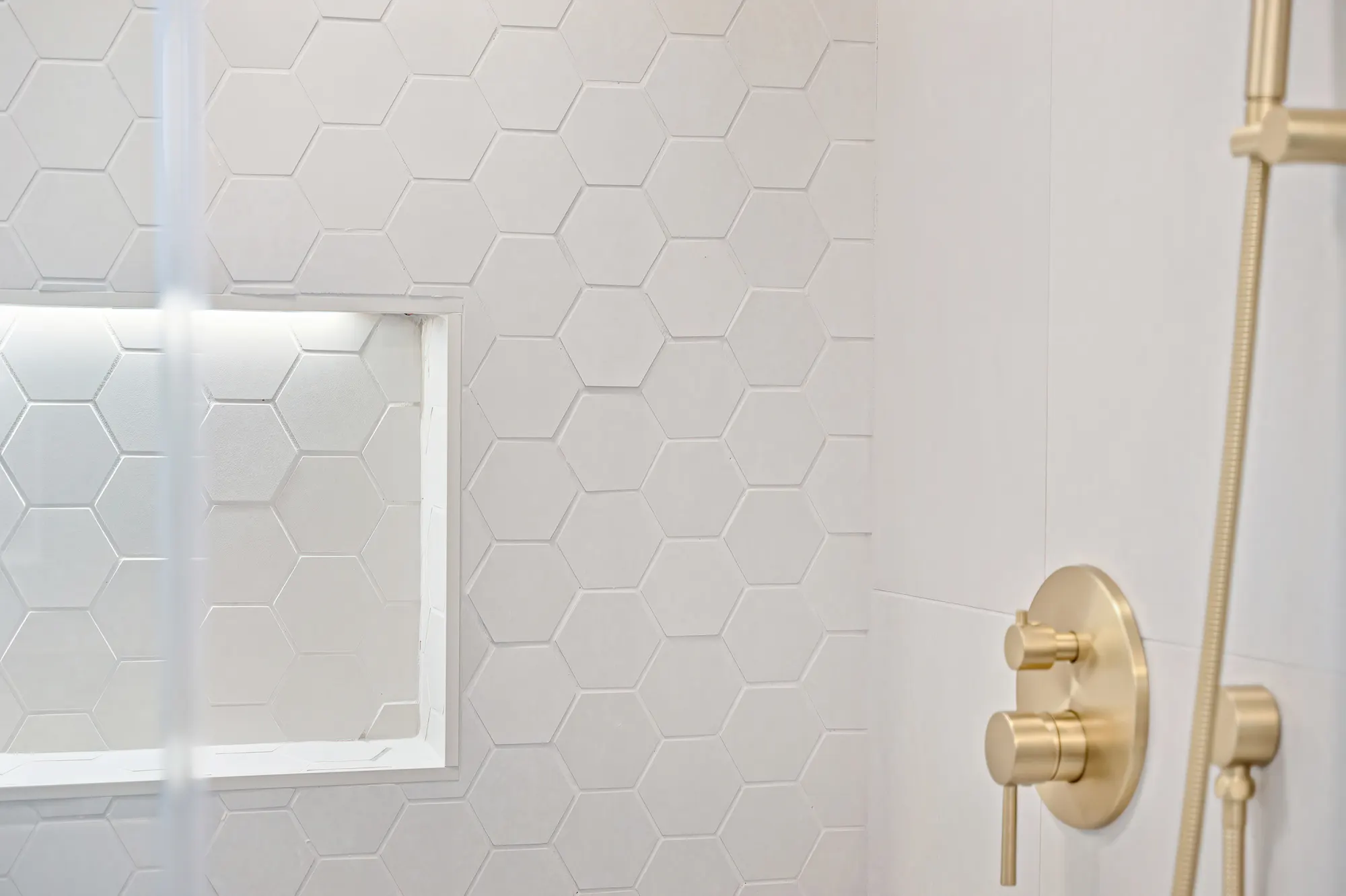 Double vanity bathroom remodel with gold hardware