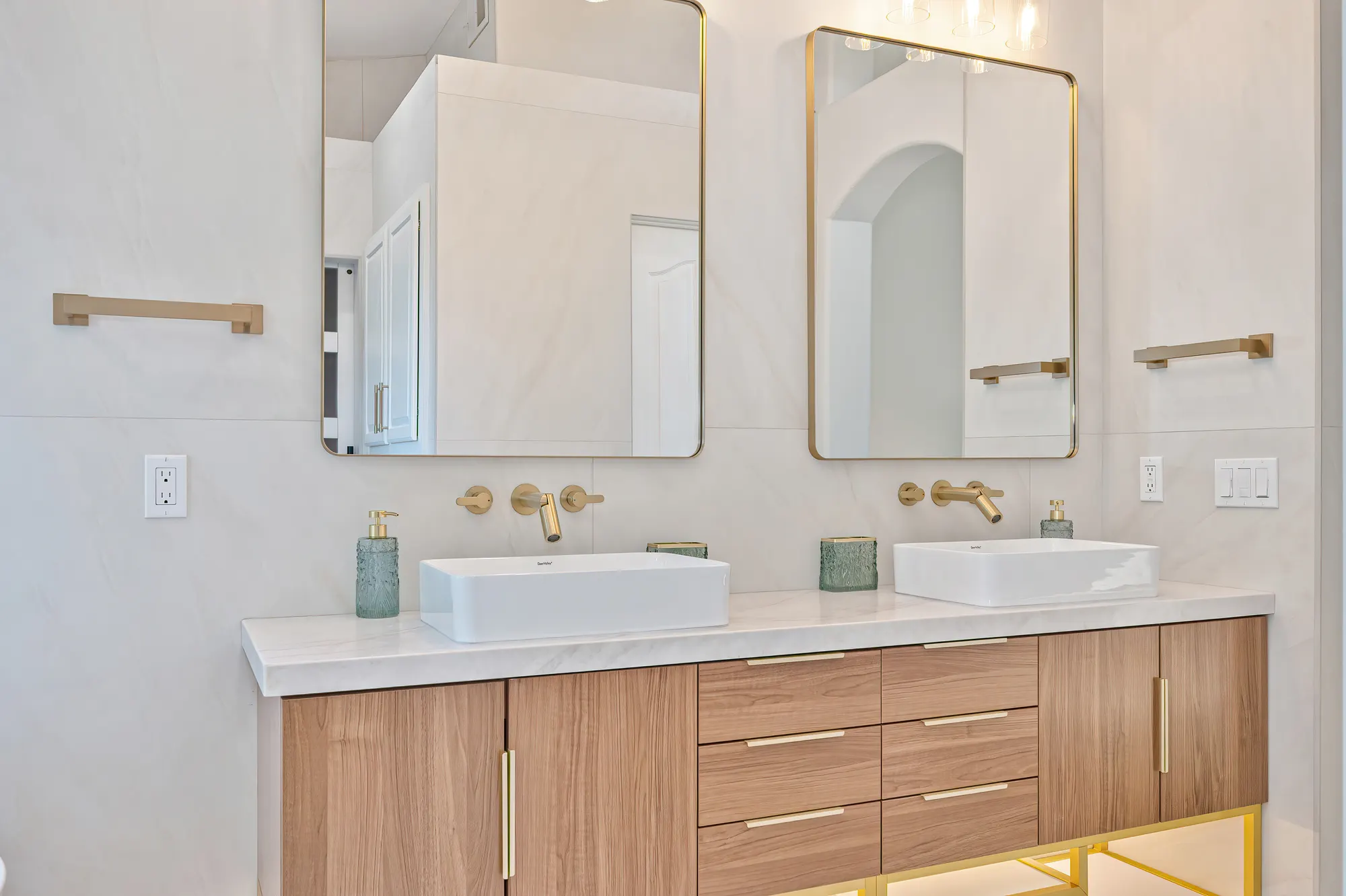 Double vanity bathroom remodel with gold hardware