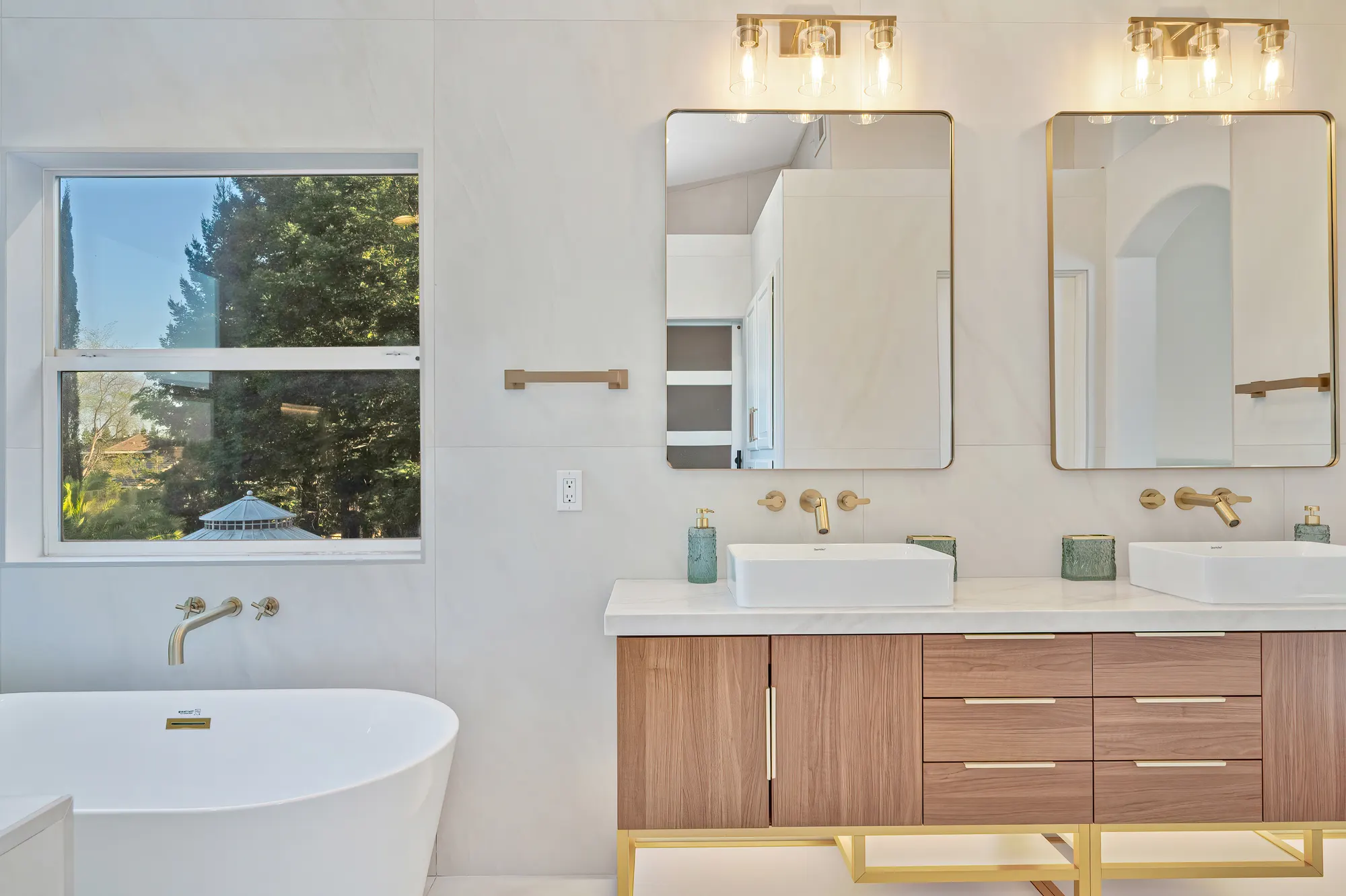 Double vanity bathroom remodel with gold hardware