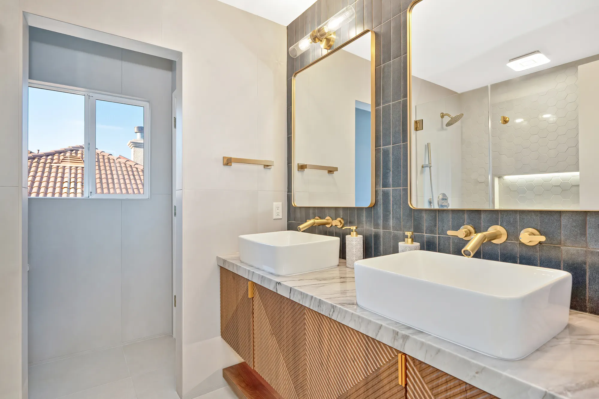Double vanity bathroom remodel with gold hardware