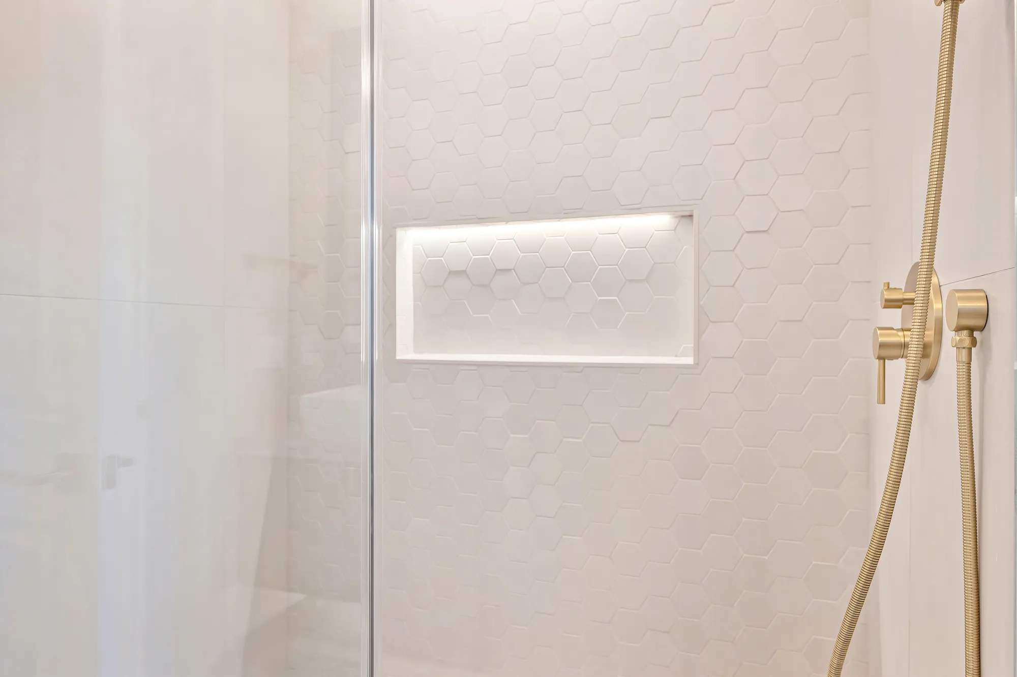 Spa bathroom with walk-in shower and custom wood vanity