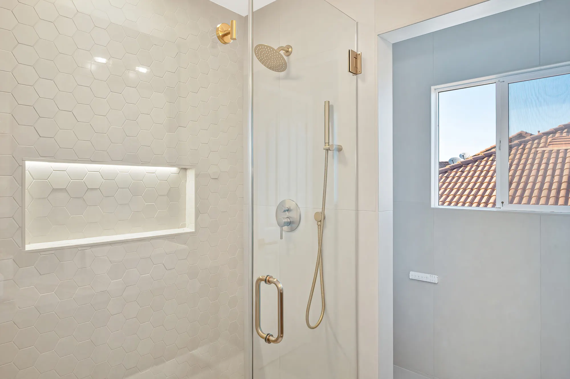 Spa bathroom with walk-in shower and custom wood vanity