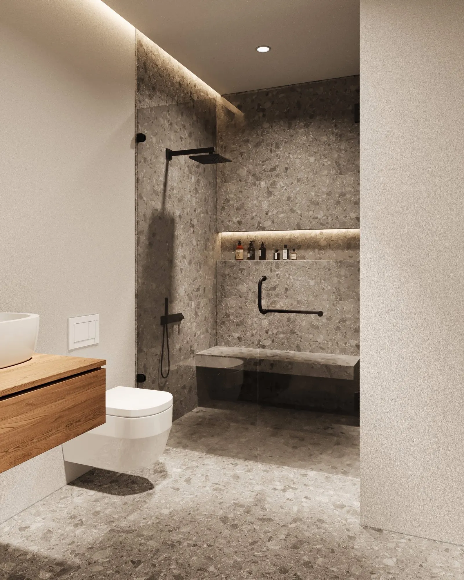 Accessible curbless shower with L-shaped grab bar and built-in stone bench